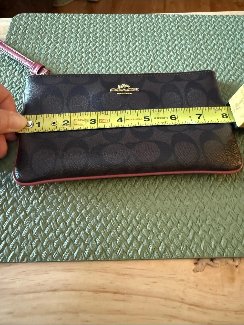 Coach Brown Signature Wristlet with Pink Trim and Gold Logo